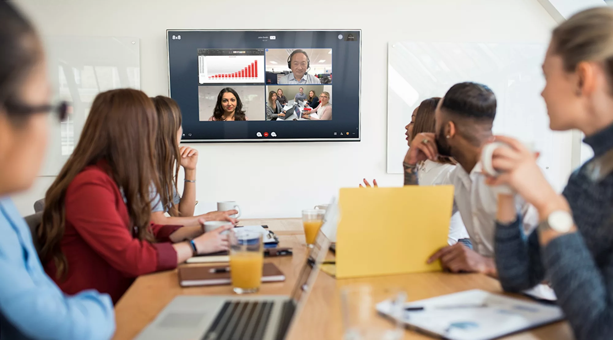 business meeting at conference room with virtual meeting participants together